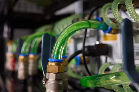 Close-up view of modern server hardware with liquid cooling pipes ensuring op Stock Photos