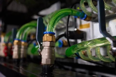 Close-up view of modern server hardware with liquid cooling pipes ensuring op Stock Photos