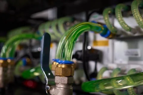 Close-up view of modern server hardware with liquid cooling pipes ensuring op Stock Photos