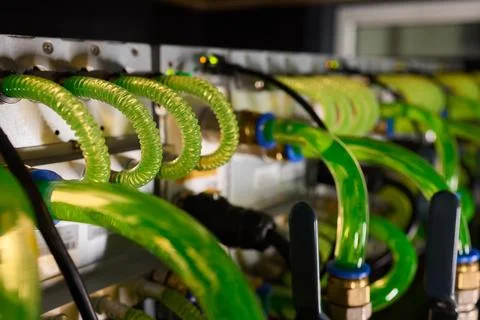 Close-up view of modern server hardware with liquid cooling pipes ensuring op Stock Photos