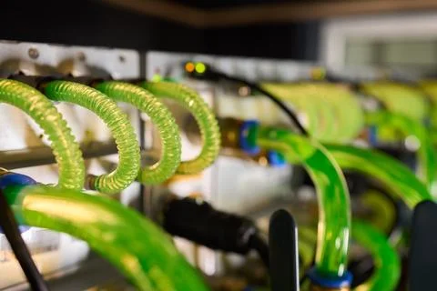Close-up view of modern server hardware with liquid cooling pipes ensuring op Stock Photos