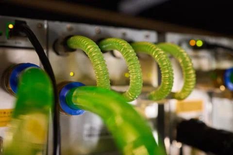 Close-up view of modern server hardware with liquid cooling pipes ensuring op Stock Photos