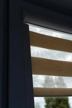 Close-up view of modern window blinds with alternating sheer and solid strips, Stock Photos