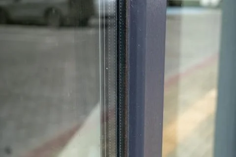 Close view of modern window showing clean glass and frame in city area with.. Фото