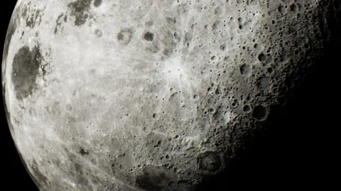 Close view of the moon showing craters and surface details at night Stock Footage 345054451
