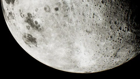 Close view of the moon showing its surface details at night Stock Footage 344390192