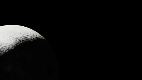 Close view of the moon showing surface details and shadows at nighttime Stock Footage 344852050