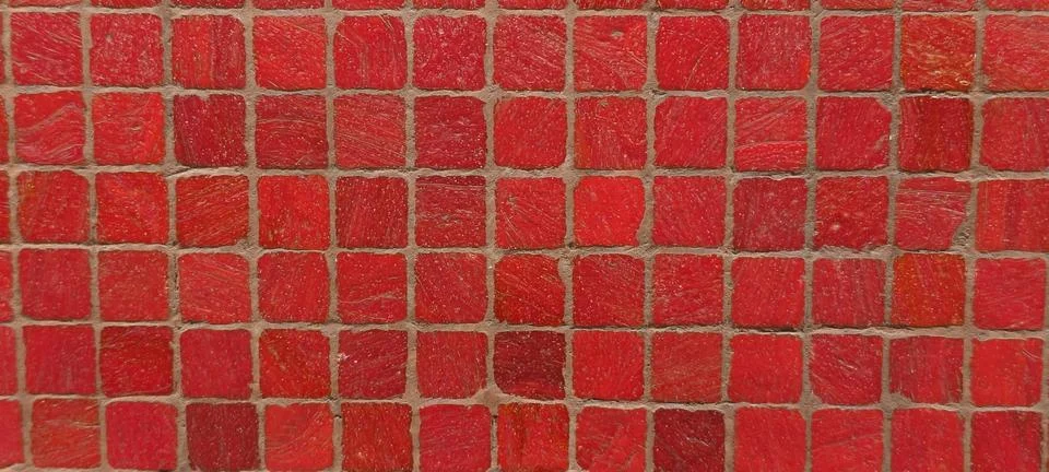 Close‑up view of a mosaic pattern made of small red square tiles 库存照片