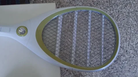 A close up view of mosquito bat or bug zapper racket or electric fly swatter Stock Footage 322900523