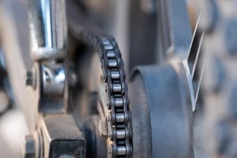 Close up view of the motorcycle drive chain on a wheel Stock Photos