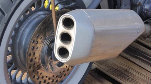 Close up view of a motorcycle engine. exhaust pipe. Stock Footage 89227843