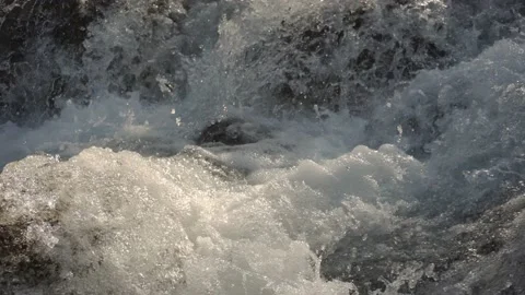 A close view of movement of powerful mountain stream jumping from stone to stone Stock Footage 164250826