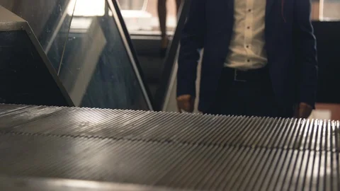 Close up view of moving escalator with people standing Stock Footage 95653220