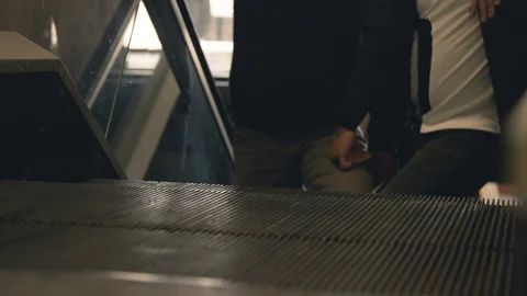 Close up view of moving escalator with people standing Stock Footage 95654167