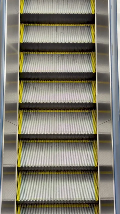 Close Up View of Moving Escalator Steps in Tokyo Japan Stock Footage 332098525