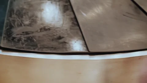 Close view on moving slates or leaves of empty luggage carousel at airport. Stock Footage 316077720