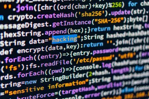 Close-up view of multi-colored computer code on a light gray background, in.. 写真素材