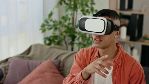 Close view of the multi ethnic man use vr headset glasses at home for studying Stock Footage 228780432