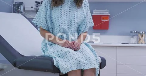 Close view of multi ethnic woman sitting on medical seat at hospital clinic Stock Photos