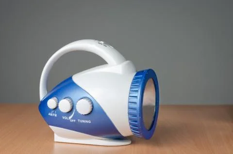 Close-up view of multi-function  old portable  retro blue   radio device . Stock Photos