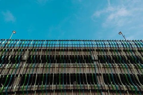 Close view of a multi storey car parking garage with green facade elements an Stock Photos