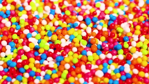 Close Up View of Multicolored Sugar Sprinkles Shaking and Moving Stock Footage 326019641