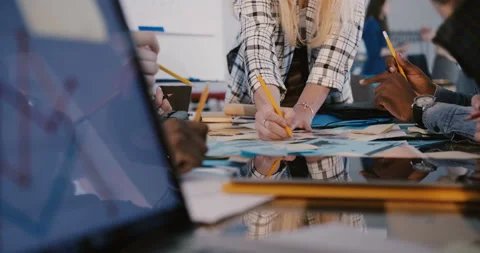 Close-up view of multiethnic team working together behind office table, woman Stock Footage 106156733