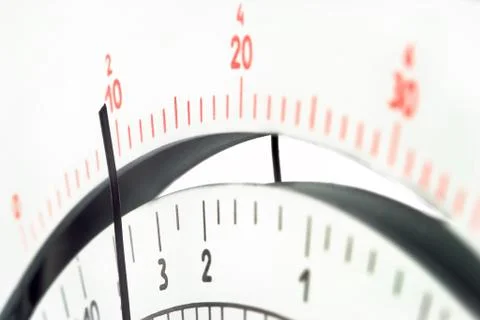 Close up view of multimeter scale with pointer. Selective focus on center par Stock Photos