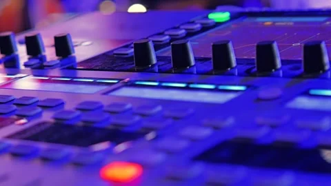 A close-up view of a music production device, featuring black knobs and buttons 스톡 동영상 305752020