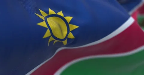 Close-up view of the Namibia national flag wavin Stock Footage 233789596