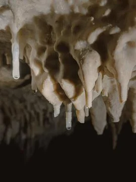 Close-up View of Natural Stalactite Formations with Dripping Water Inside a.. Stock Photos