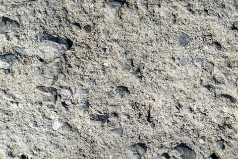 Close-up view of natural stone texture, showing detailed rock surface and r.. Stock Photos