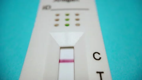 Close-up view of the negative result of the Covid-19 rapid test at home Stock Footage 168730380
