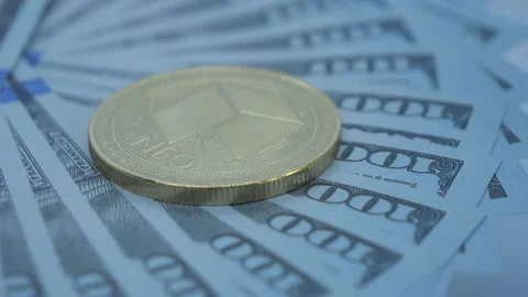 A close up view of Neo cryptocurrency on the 100 dollars notes. Stock Footage 157294590