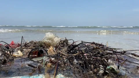 Close up view netting mesh dirty garbage trash on sand ocean wave Video stock 252161022
