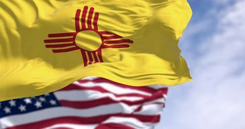 Close-up view of the New Mexico and United States flags waving Иллюстрация