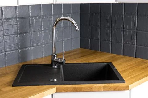Close up view of new modern kitchen solid wood butcher block oak counter. Stock Photos