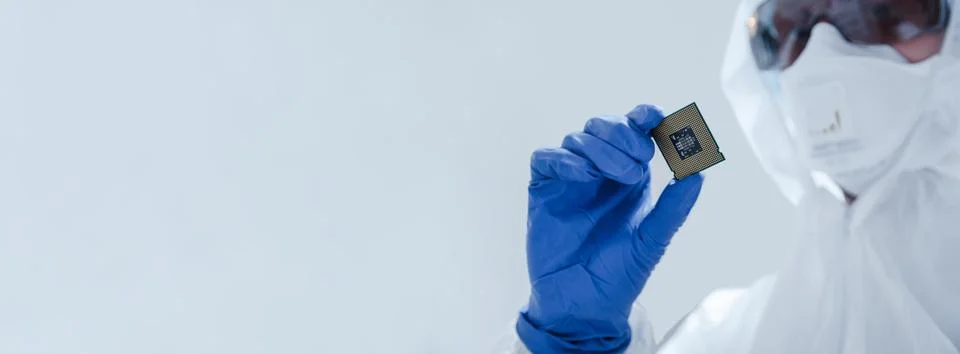 Close-up view on a new semiconductor microchip in gloved hand of computer 스톡 사진