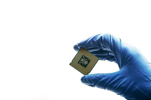 Close-up view on a new semiconductor microchip in gloved hand of computer Stock Photos