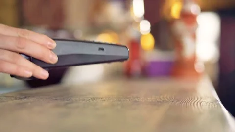 Close-up view of a NFC transaction with a smartphone. Stock Footage