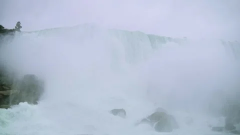 Close-up view of Niagara Falls obscured by dense mist powerful water spray Video stock 291985236