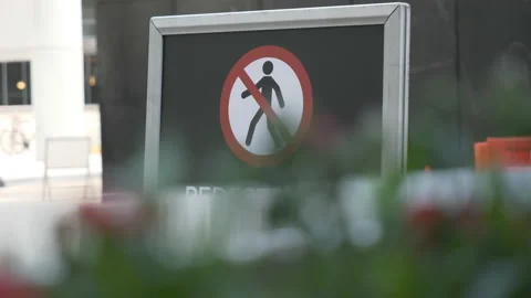 A close up view of a ‘no walking’ sign on a street. Stock Footage 153312748
