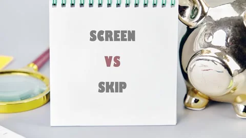 A close up view of a notepad displaying the words screen versus skip alongside a Stock Footage 333527329