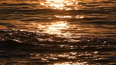 Close up view of ocean waves in sunset Stock Footage 138022719