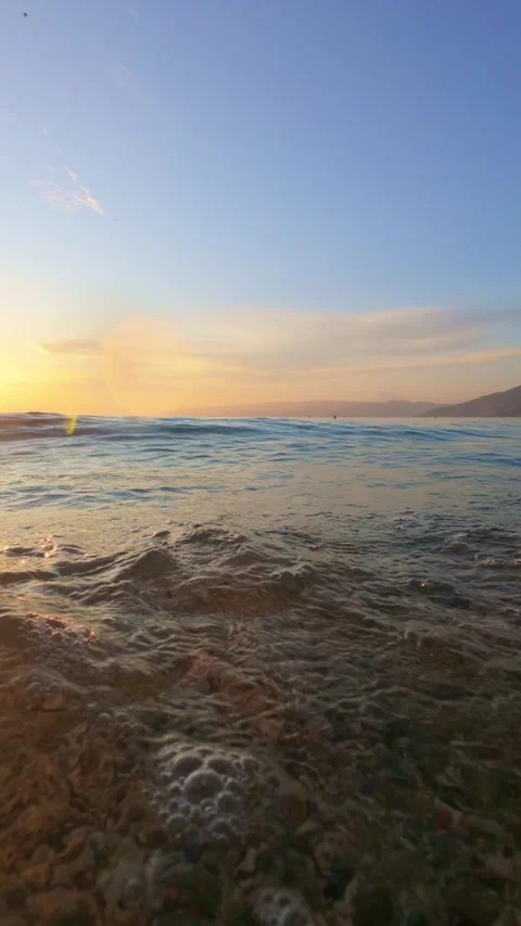 Close-Up View of Ocean Waves at Sunset Stock Footage 305978332