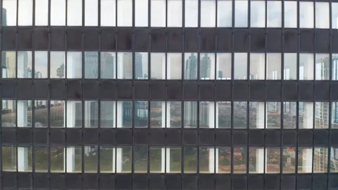 Close up view of an office building windows from a drone flying down Stock Footage 103951700