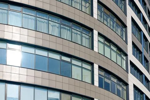 Close up view to office skyscraper windows, high business building windows wi Stock Photos