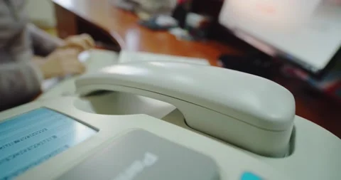 Close up view office worker, female hand picks up the phone with a fax machine. Stock Footage