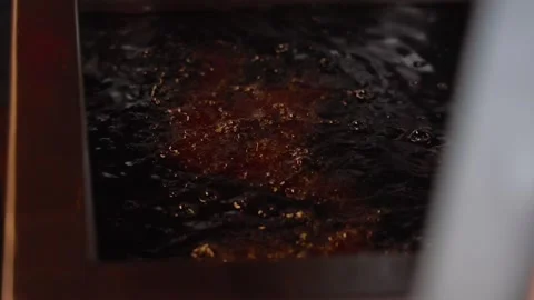 Close up view of oil boiling in a deep fryer Stock Footage 244828422