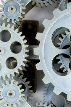 Close view of old clock mechanism with gears and cogs. Conceptual photo for y Stock Photos